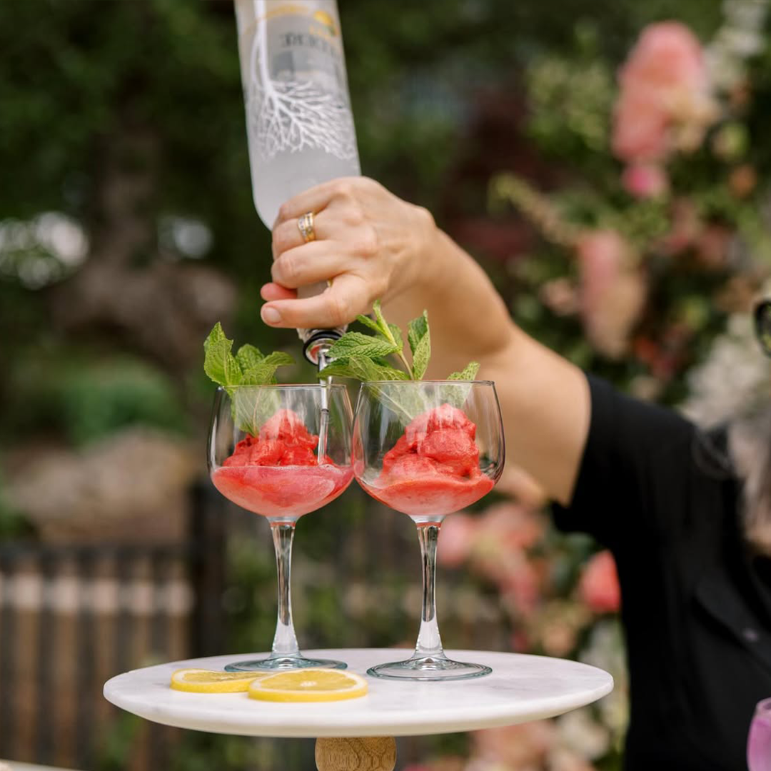 Friendly bartender taking drink order at wedding bar