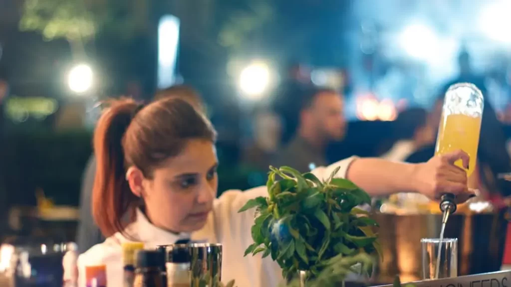 Professional bartender serving cocktails at a Goa beach wedding